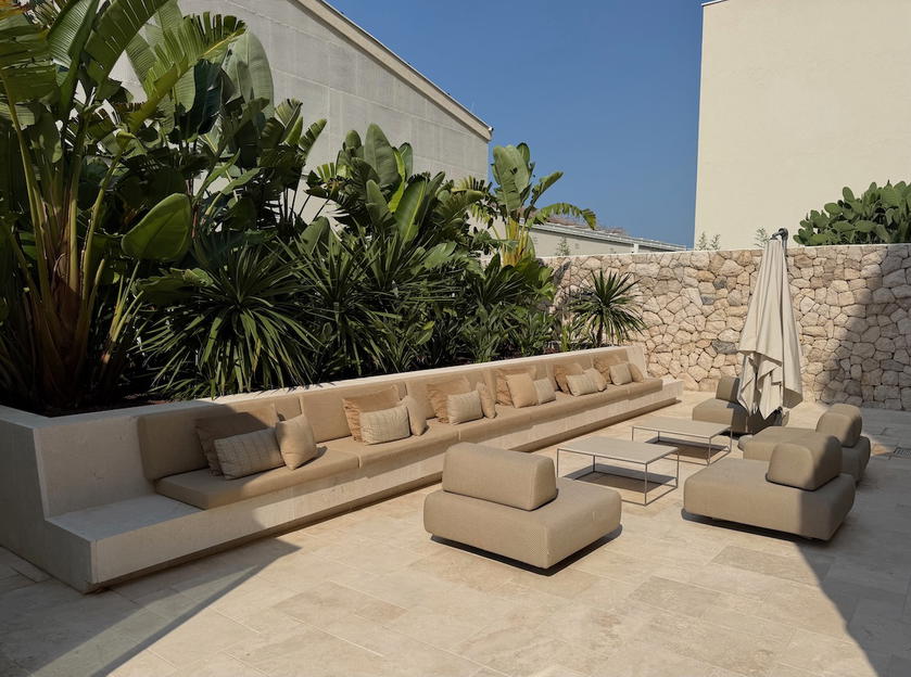 Outdoor garden seating area at Villa Dubrovnik leading to the lobby