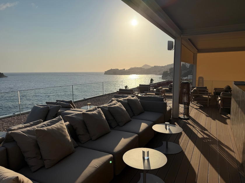 Seating area at Villa Dubrovnik's rooftop Galanto Bar overlooking the sea