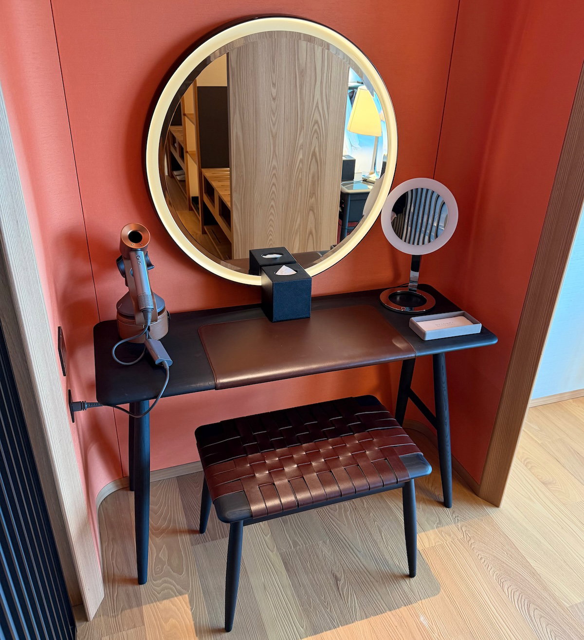 Vanity with a mirror on one side of the closet
