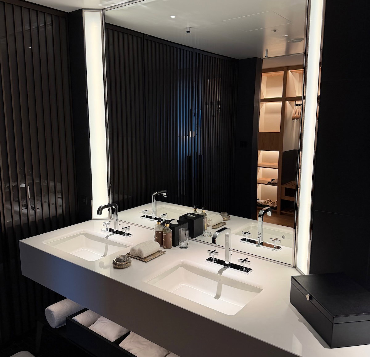 Bathroom with double sinks and a large mirror
