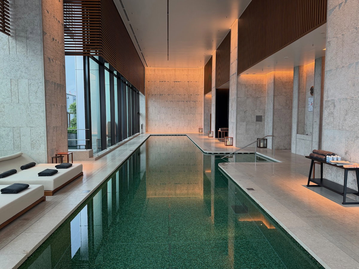 Indoor swimming pool with high ceilings and city views at Bulgari Hotel Tokyo