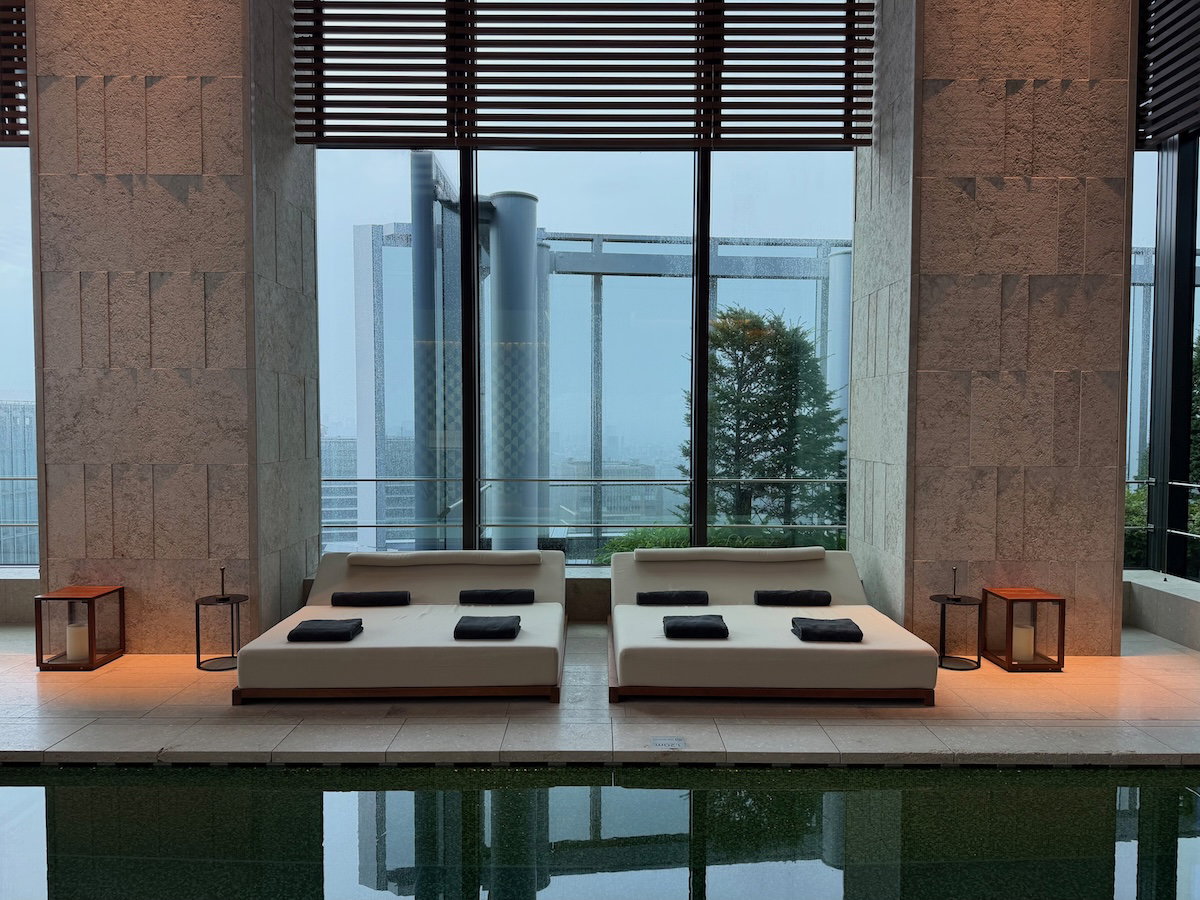 Poolside seating area with loungers at Bulgari Hotel Tokyo