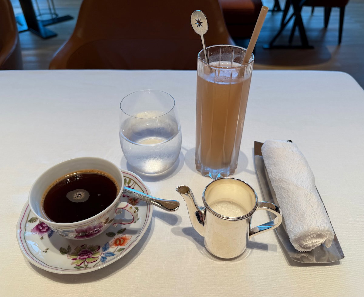 Glasses of juice and americano coffee on a breakfast table at the Bulgari Hotel Tokyo