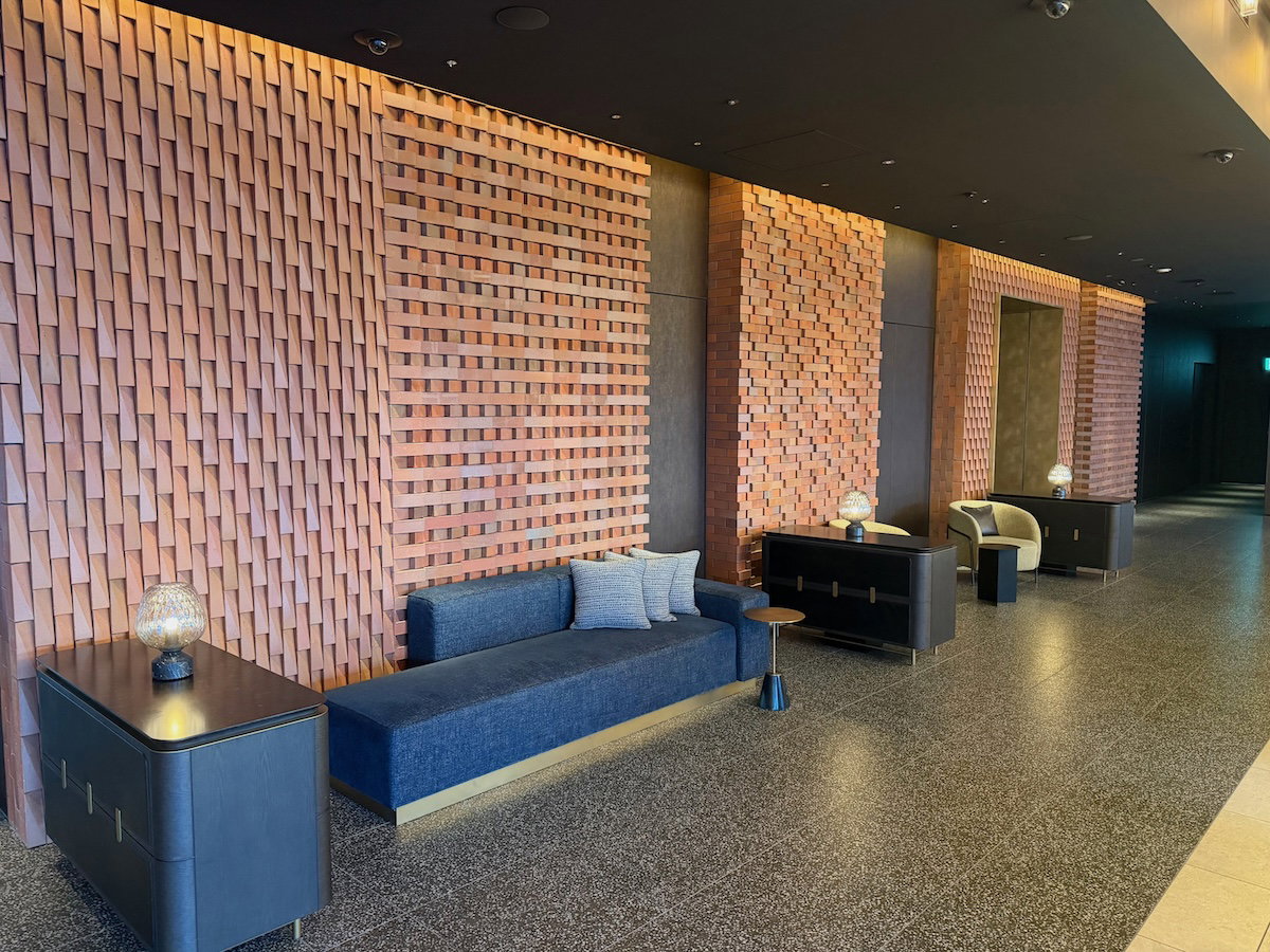 Lobby seating with brick details and modern lighting at Osaka Station Hotel