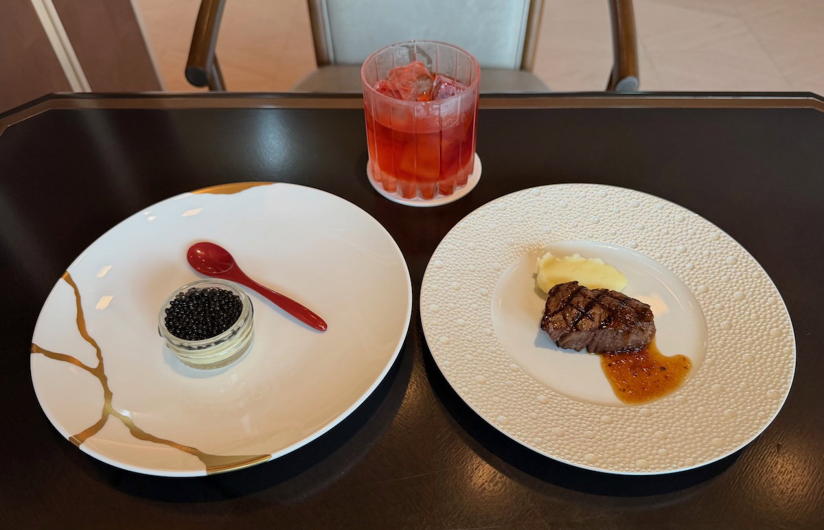 Evening food and drinks laid out in the Specialty Salon club lounge at Osaka Station Hotel