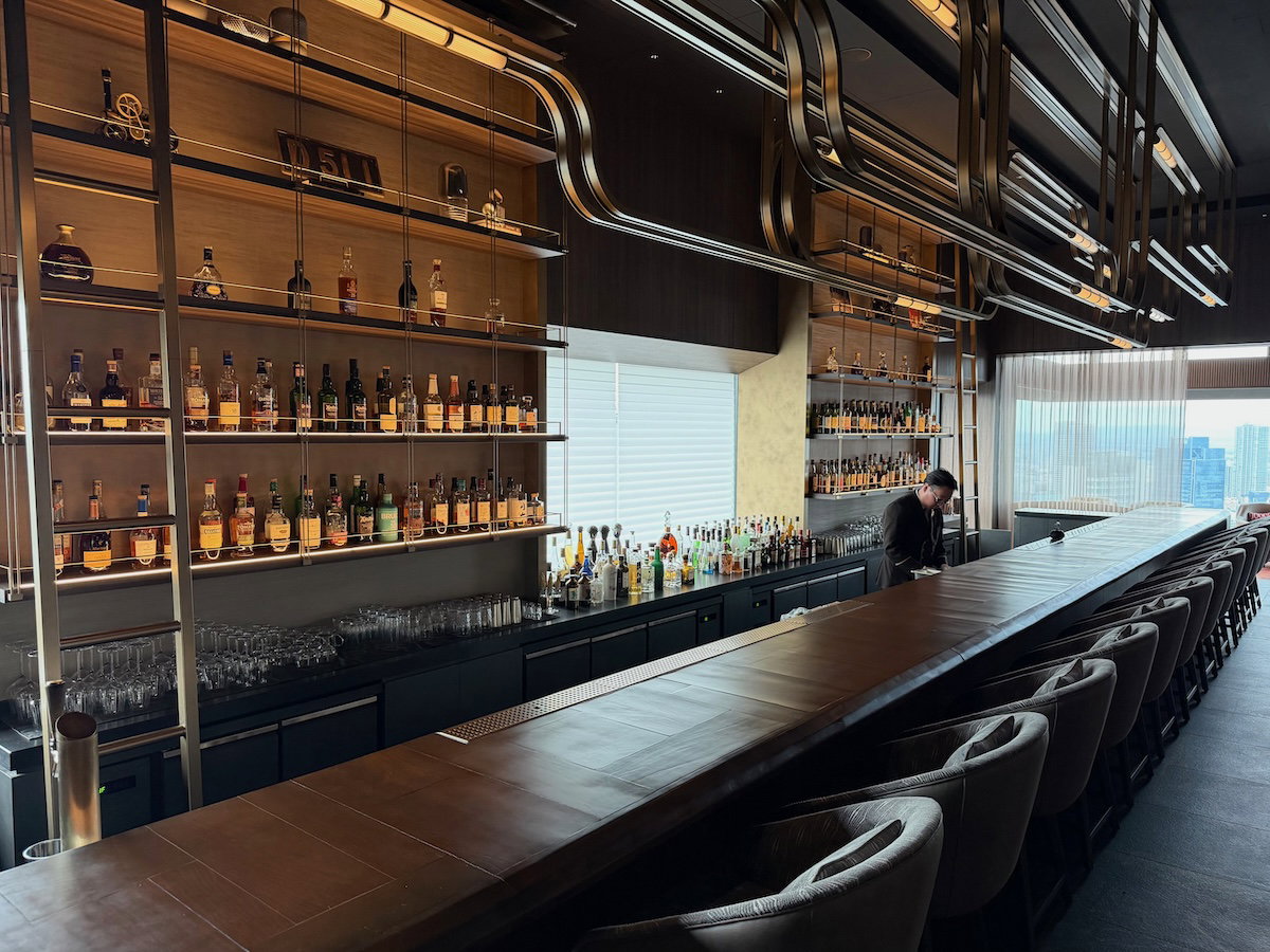 Train-themed art and seating inside the Main Bar speakeasy at Osaka Station Hotel