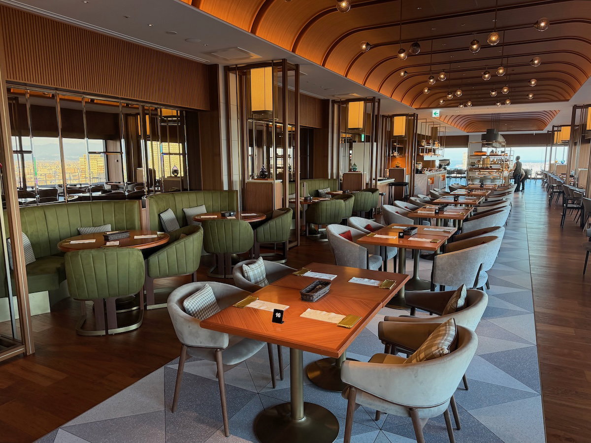 Tables and seating inside the Moment Grill & Dining restaurant at Osaka Station Hotel