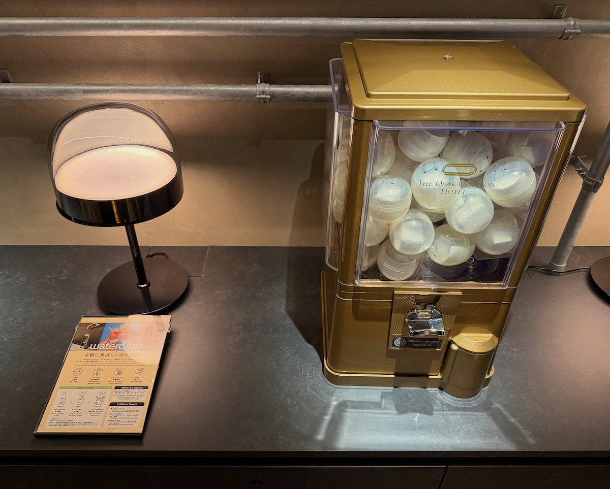 Capsule toy machines next to the lobby water station