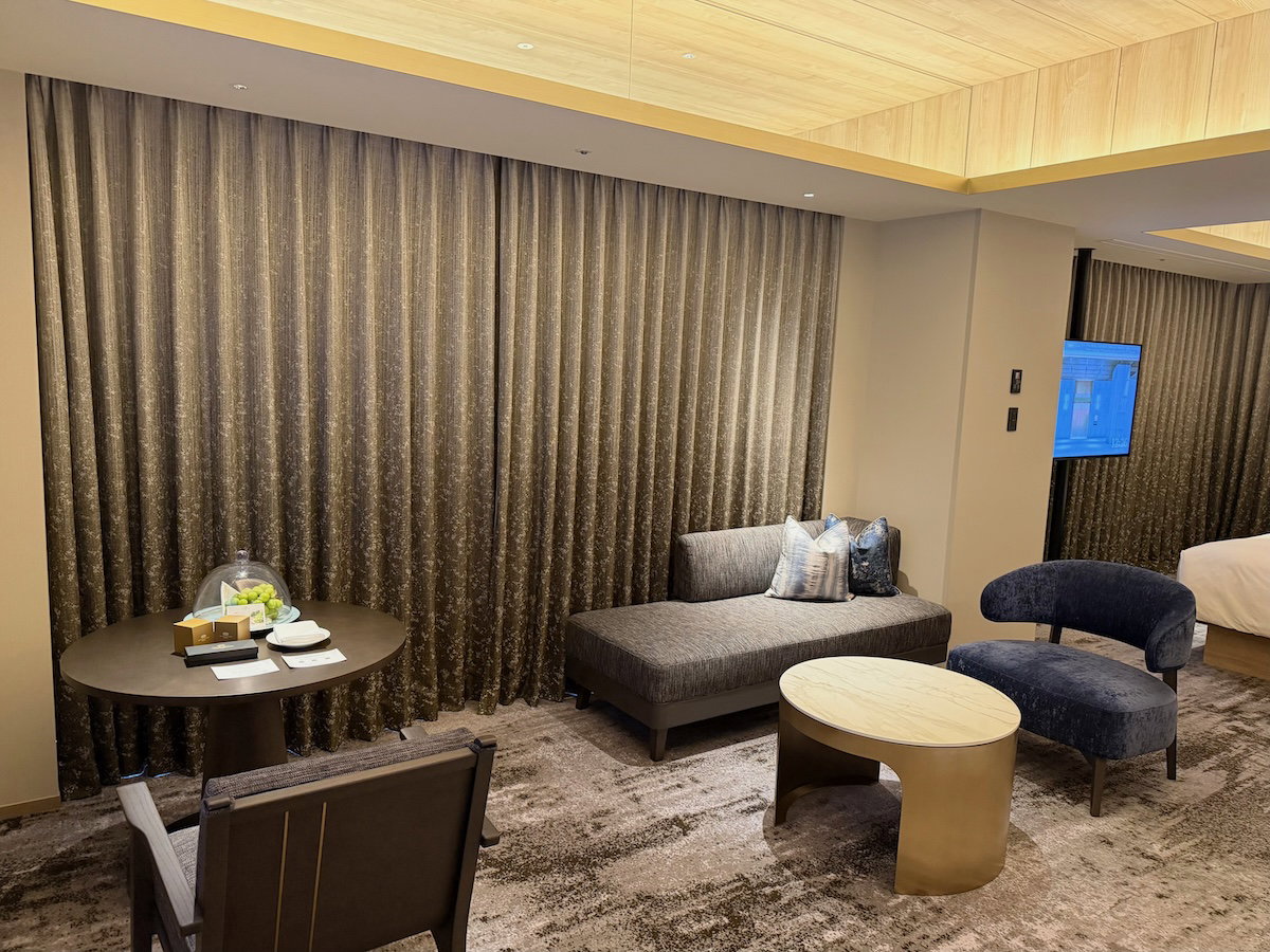 Desk with a single chair in the living area of the guest room