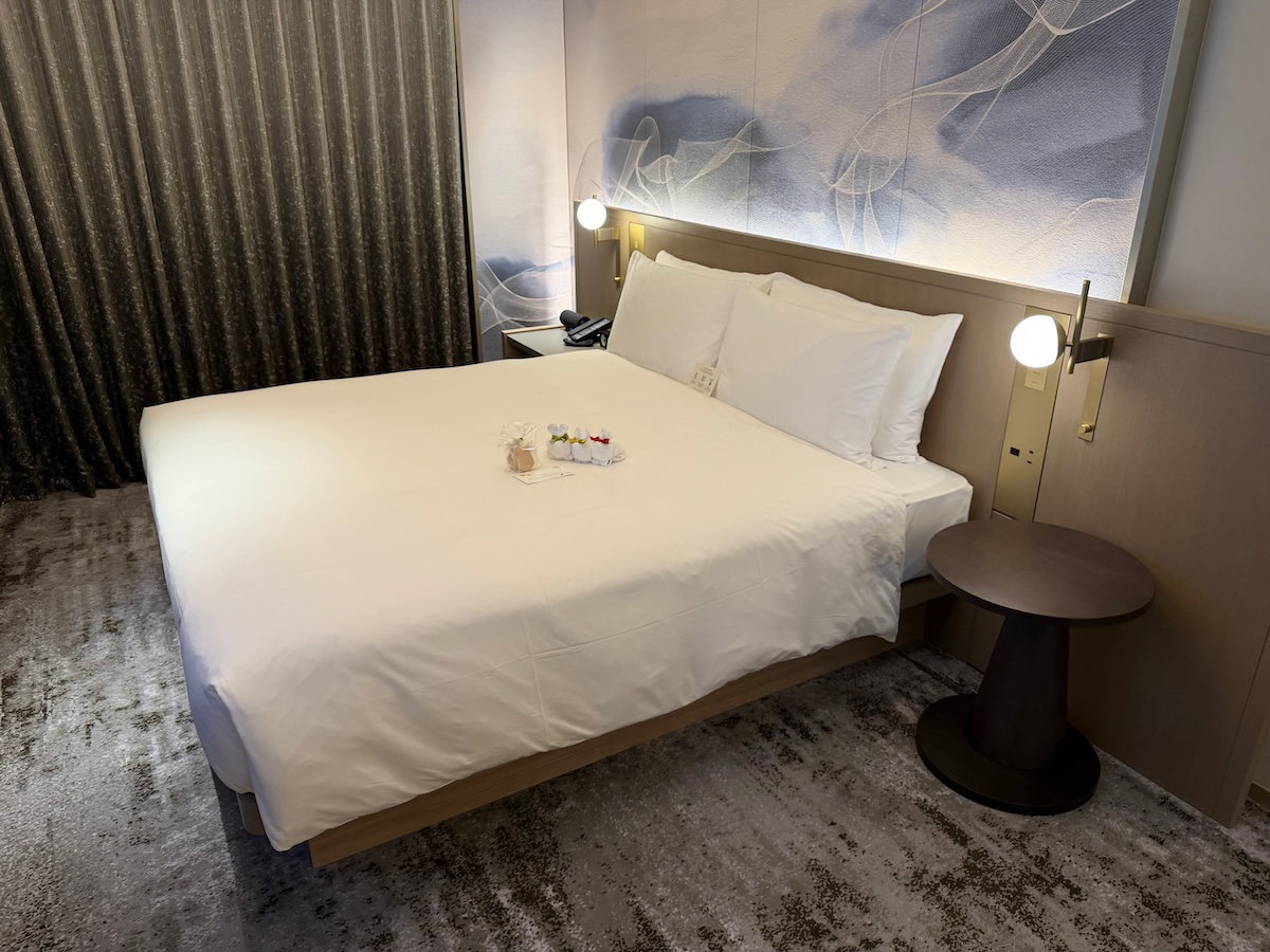 King bed in the corner of the Osaka Station Hotel guest room
