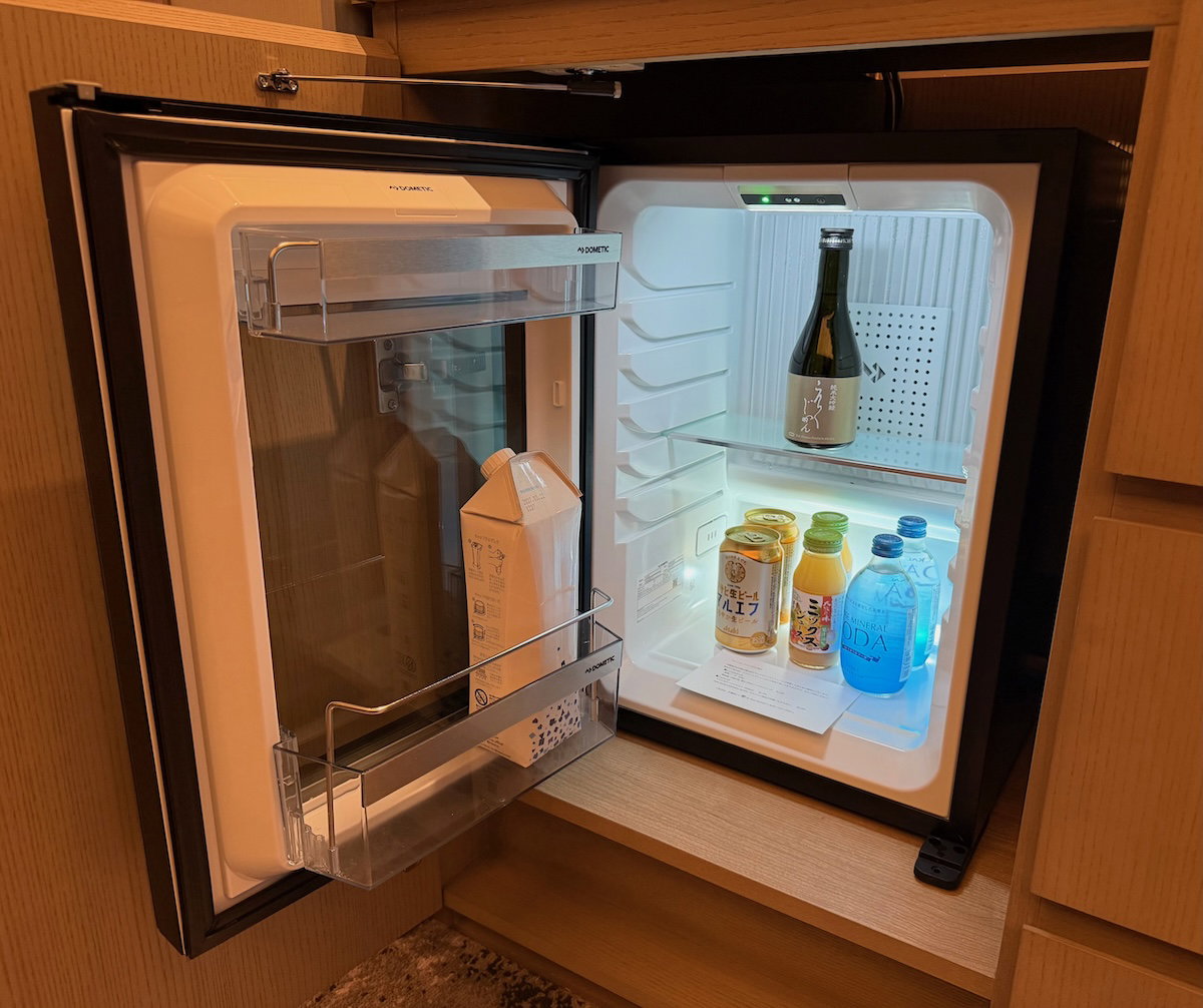 Complimentary minibar with drinks and snacks in the guest room