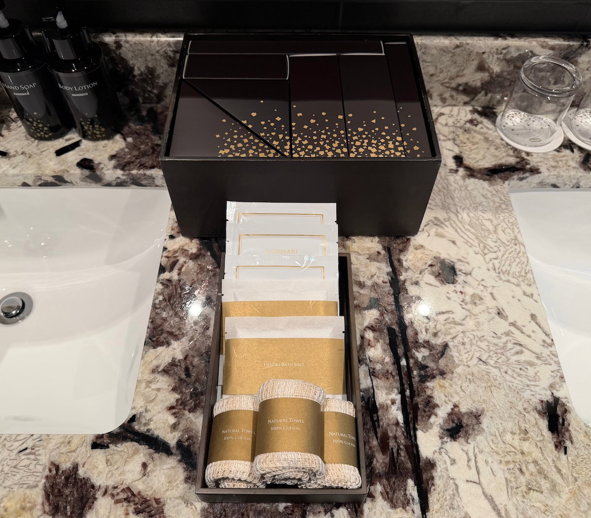 Selection of dry amenities laid out in the guest room bathroom