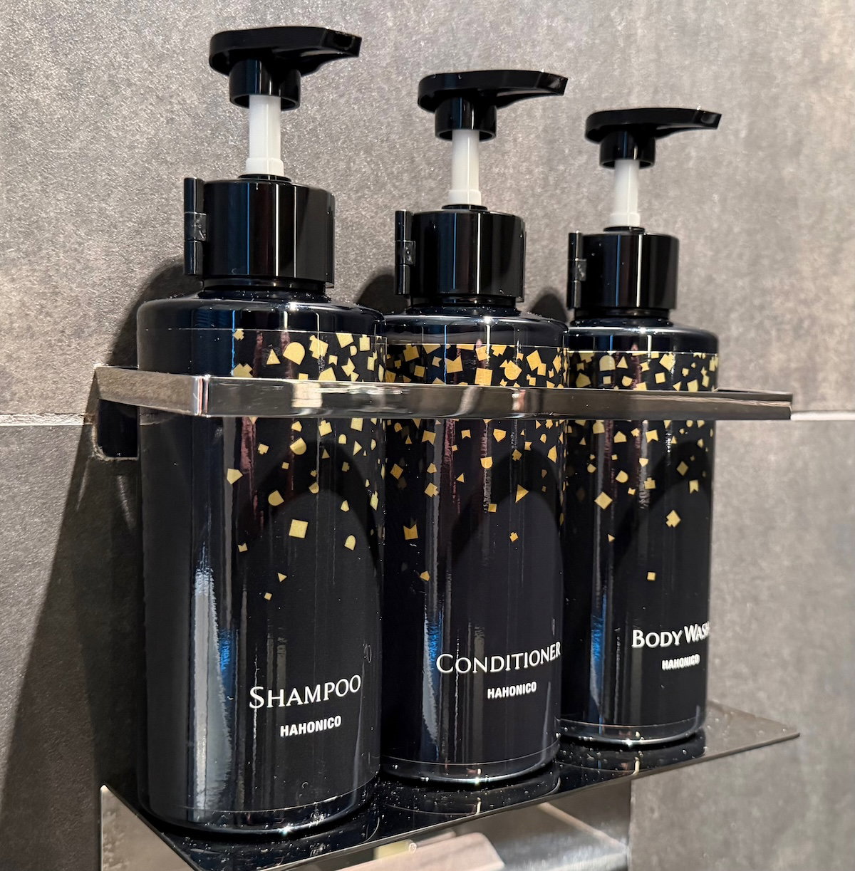 Hahonico toiletries in reusable containers in the guest room bathroom