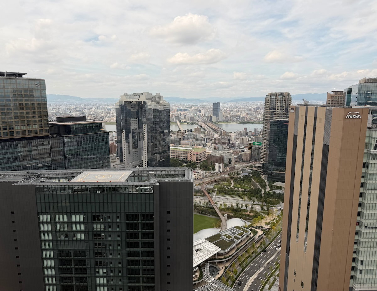 View from the guest room over surrounding buildings, with the river in the distance
