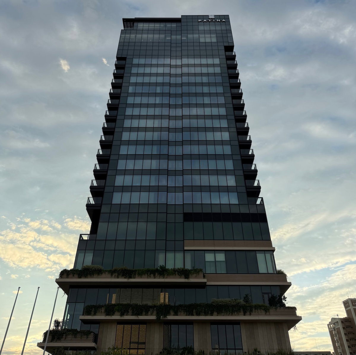 Exterior of the standalone 20-story Patina Osaka hotel building