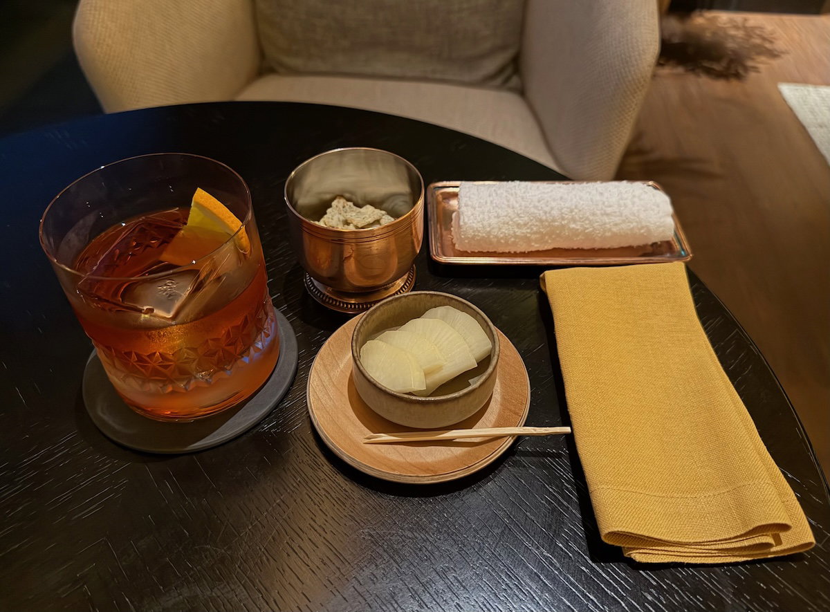 Negroni cocktail served with bar snacks at the Sonata Bar & Lounge