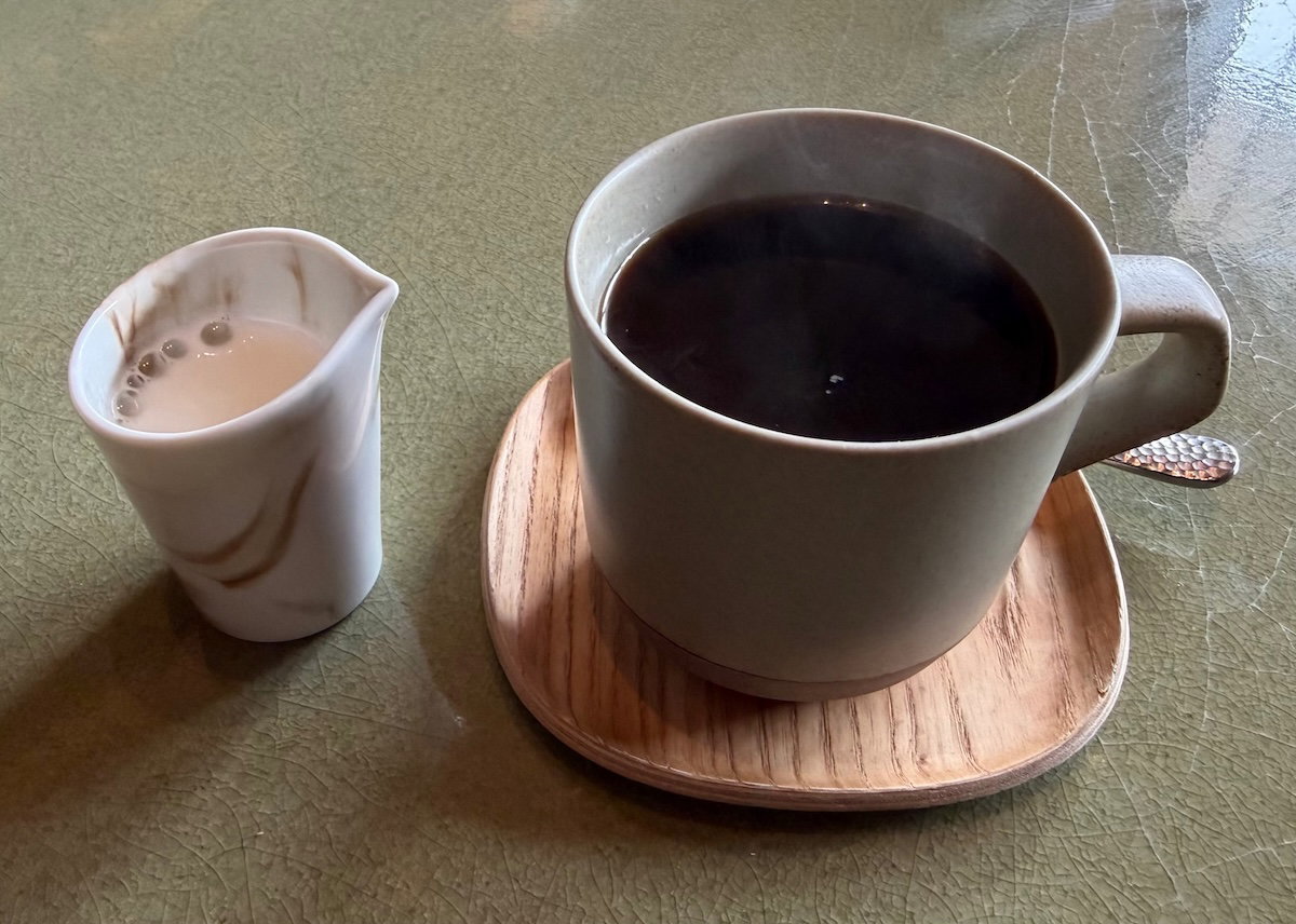 Cup of coffee served with dessert at P72 restaurant