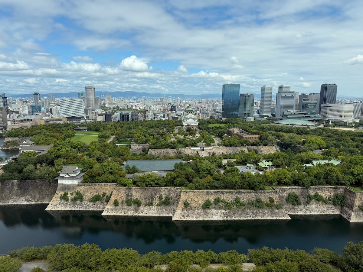 Floor-to-ceiling lobby windows overlooking Osaka Castle