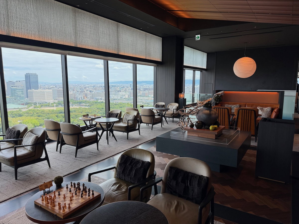 Lobby seating area at Patina Osaka with views toward Osaka Castle