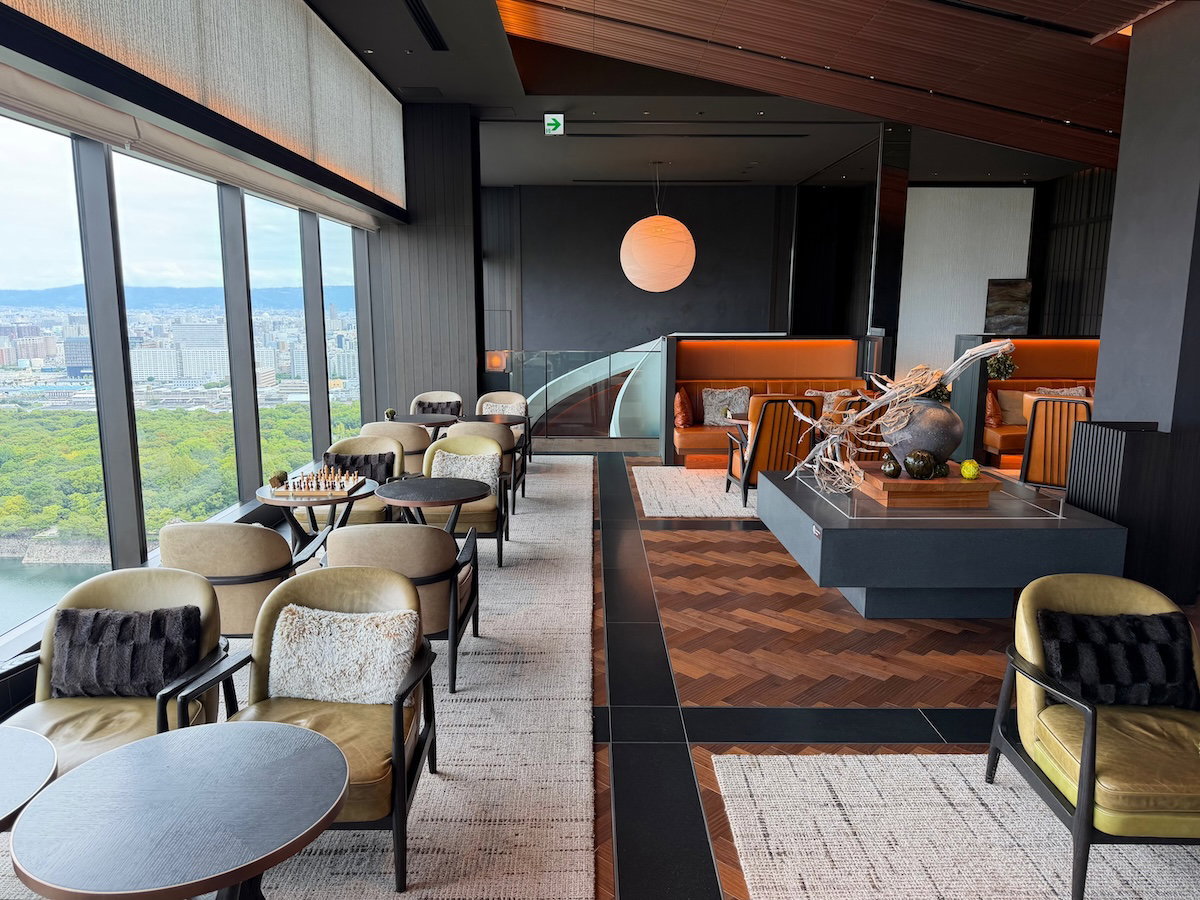 Lounge chairs and tables in the Patina Osaka lobby