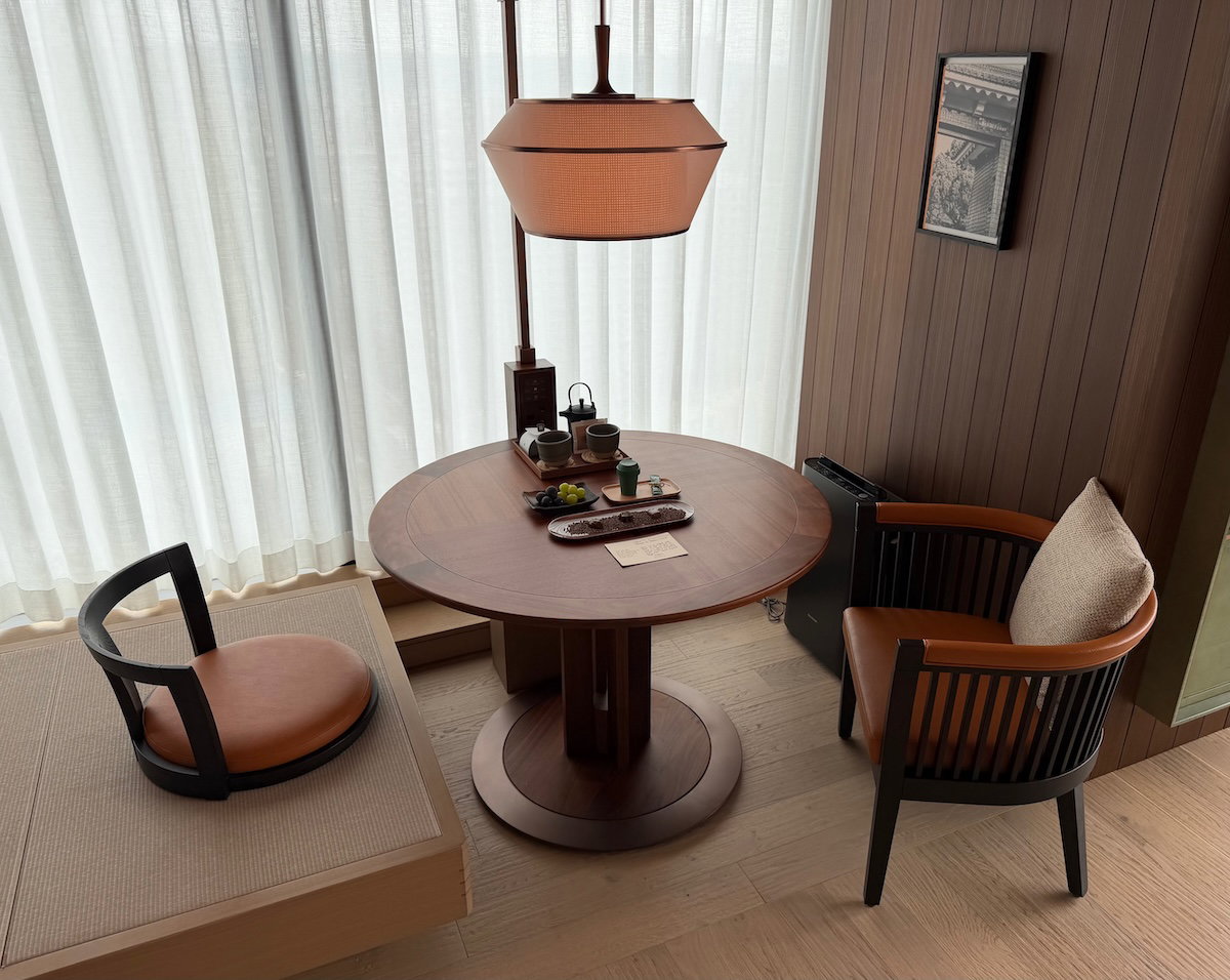 Elevated Japanese-style seating platform beside the dining table in the room