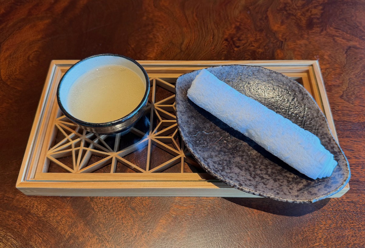 Welcome drink and cold towel served at check-in at Patina Osaka