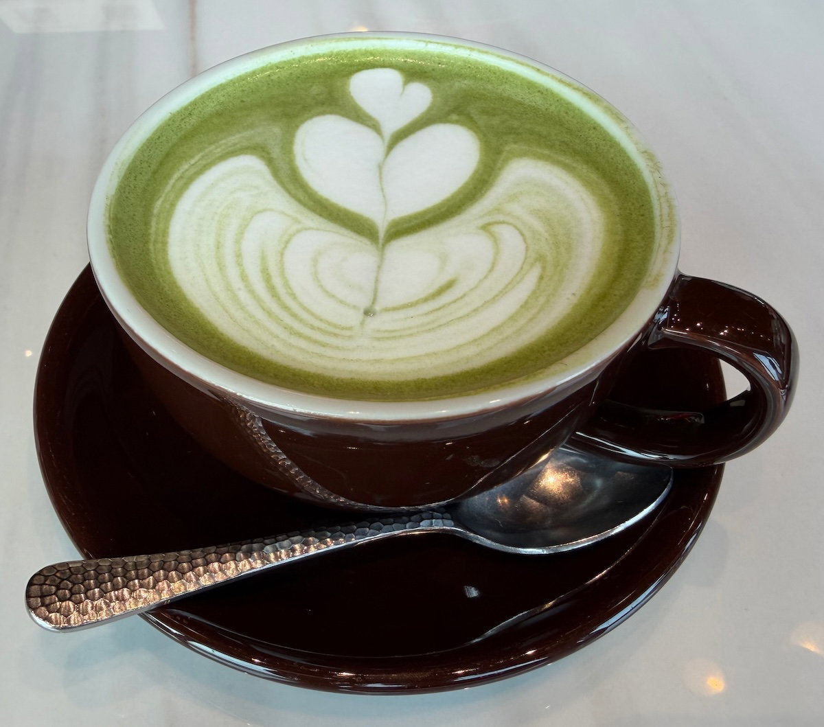 Matcha latte served at Patina Osaka breakfast