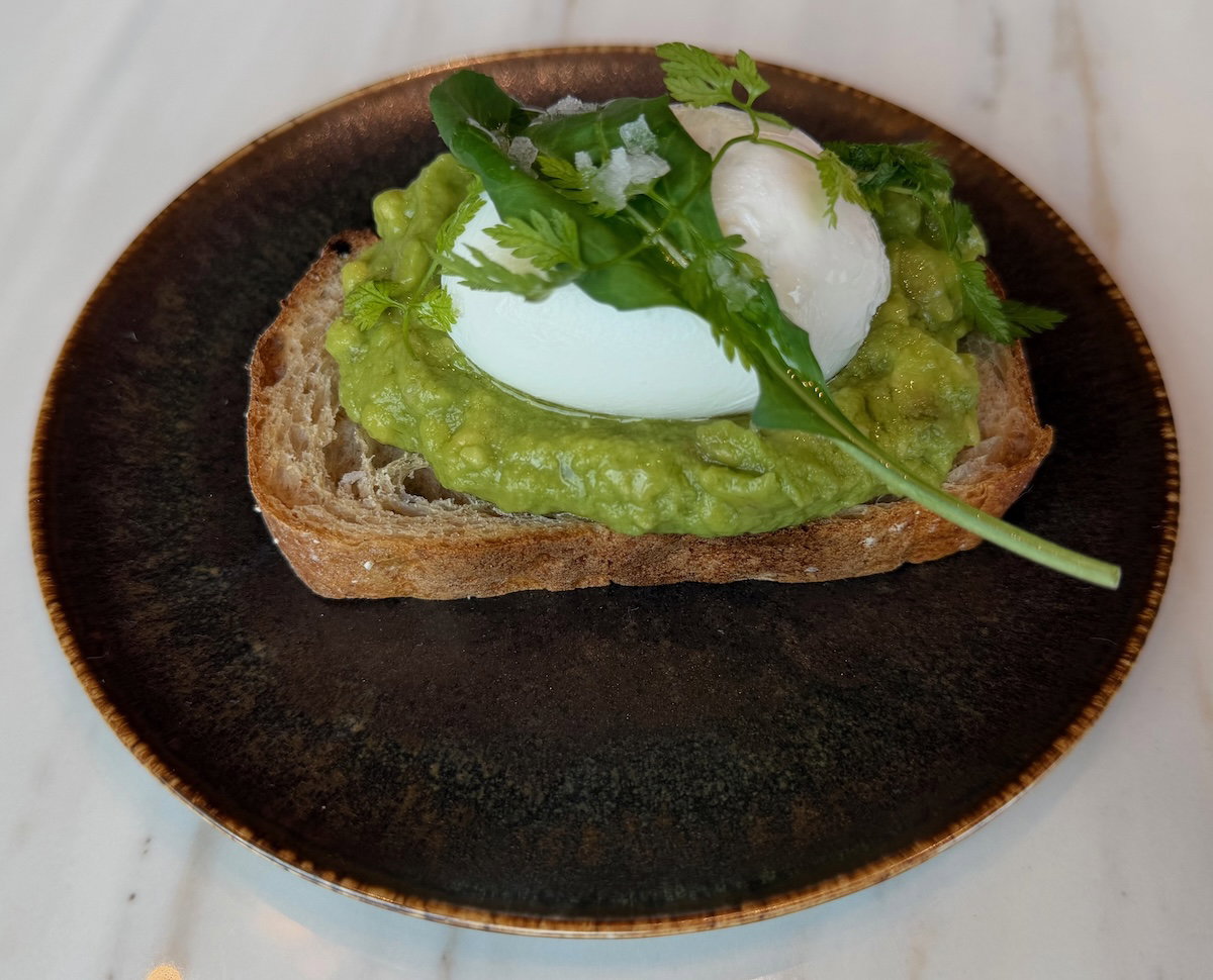 Avocado toast topped with a poached egg at Patina Osaka breakfast