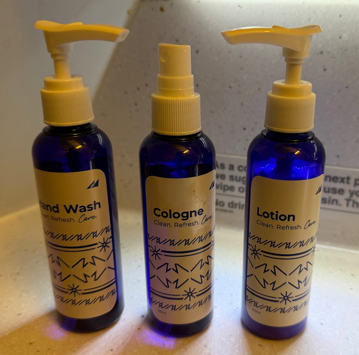 Philippine Airlines branded hand wash, lotion and cologne bottles in the A330 business class lavatory