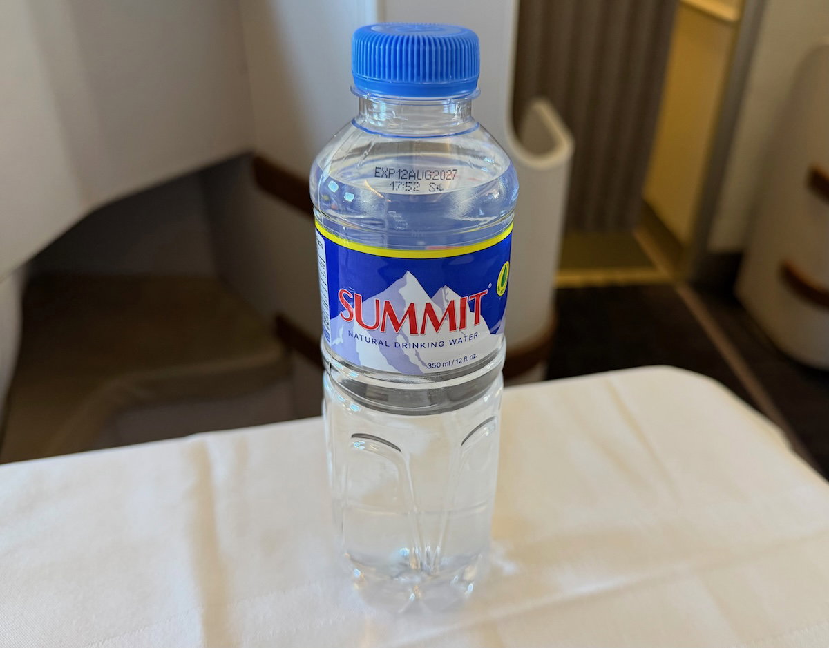 Bottle of water placed on the tray table in Philippine Airlines business class