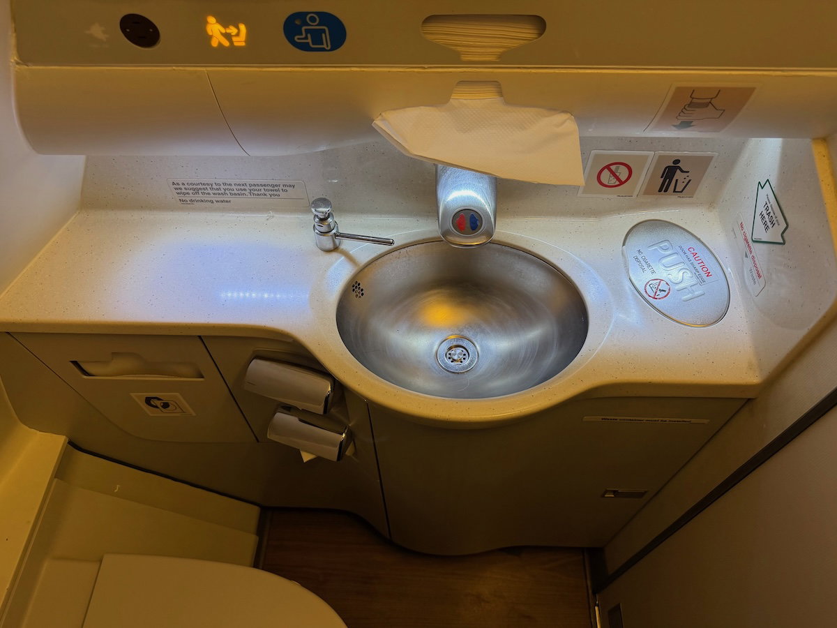 Inside the Philippine Airlines A330 business class lavatory, showing the sink and counter