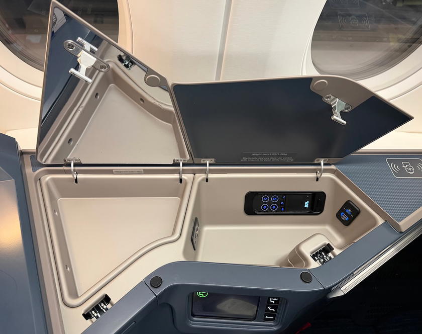 Deeper storage compartment holding the entertainment controller and USB ports