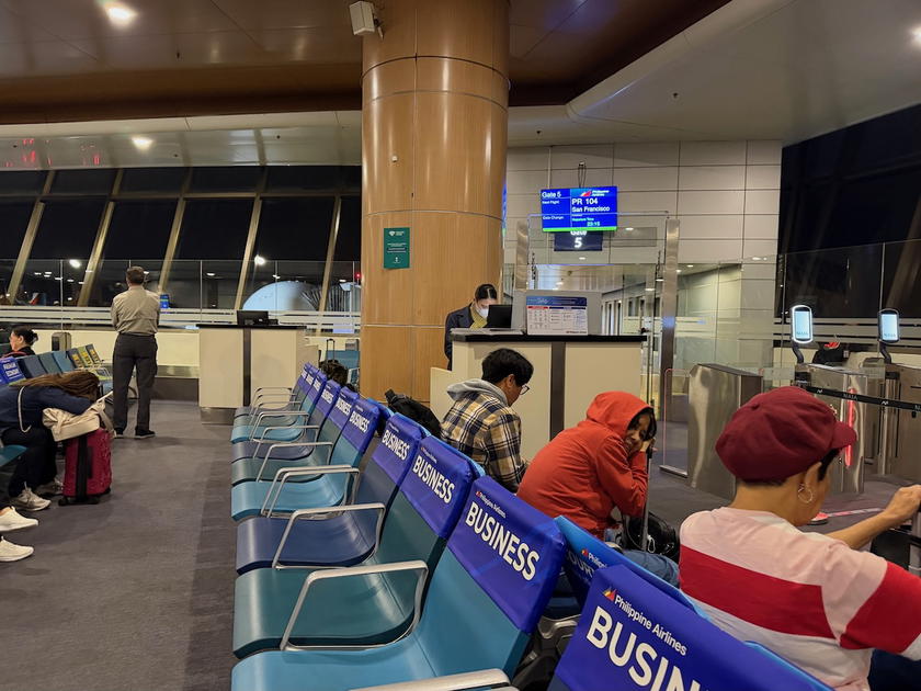 Passengers waiting at the Philippine Airlines gate in Manila ahead of boarding