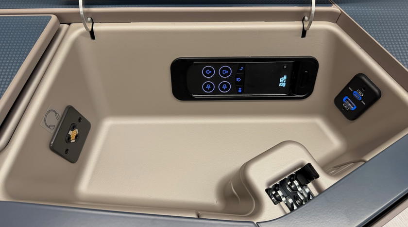 USB-A, USB-C and headphone jack inside the seat's storage compartment