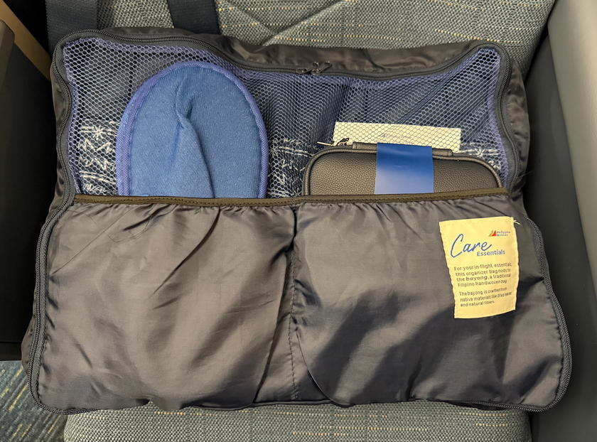 Amenities in a storage pouch at a Philippine Airlines business class seat