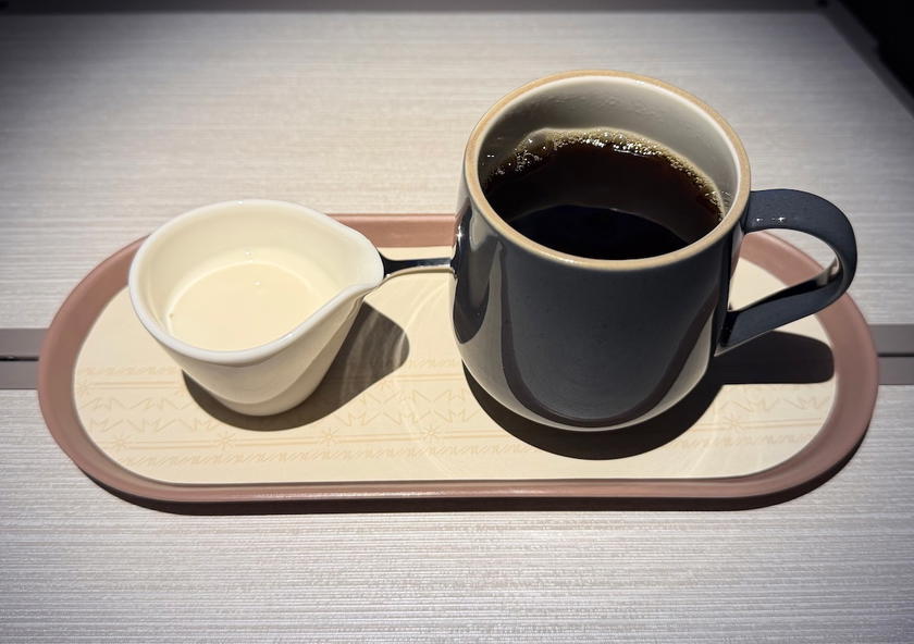 Cup of brewed coffee served on a tray in Philippine Airlines business class