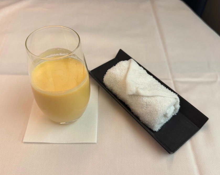 Mango smoothie served before breakfast in Philippine Airlines business class