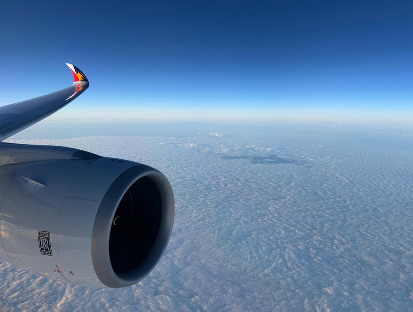 View of the Philippine Airlines A350 wing from the window during the approach to San Francisco