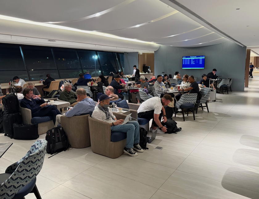 Crowded lounge seating at the Philippine Airlines Mabuhay Lounge in Manila