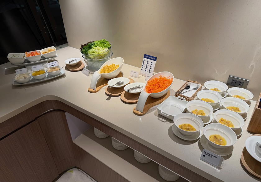 Hot dishes in serving trays at the Mabuhay Lounge buffet