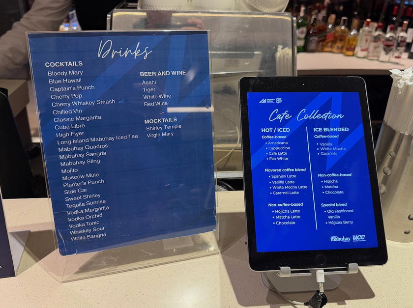 Bar counter with bottles and glasses in the Philippine Airlines Mabuhay Lounge