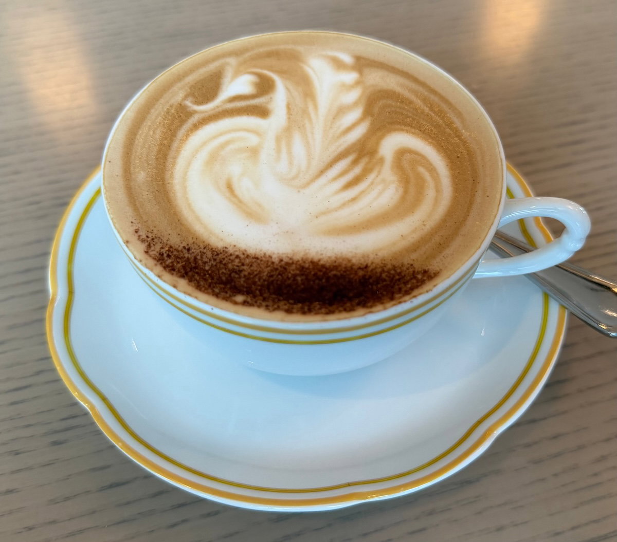 Cappuccino with latte art served at breakfast in Jolie Brasserie