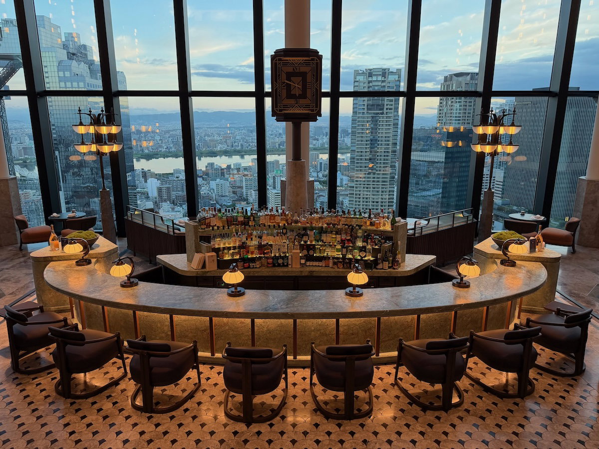 Peacock Alley lobby lounge at the Waldorf Astoria Osaka with very high ceilings and city views