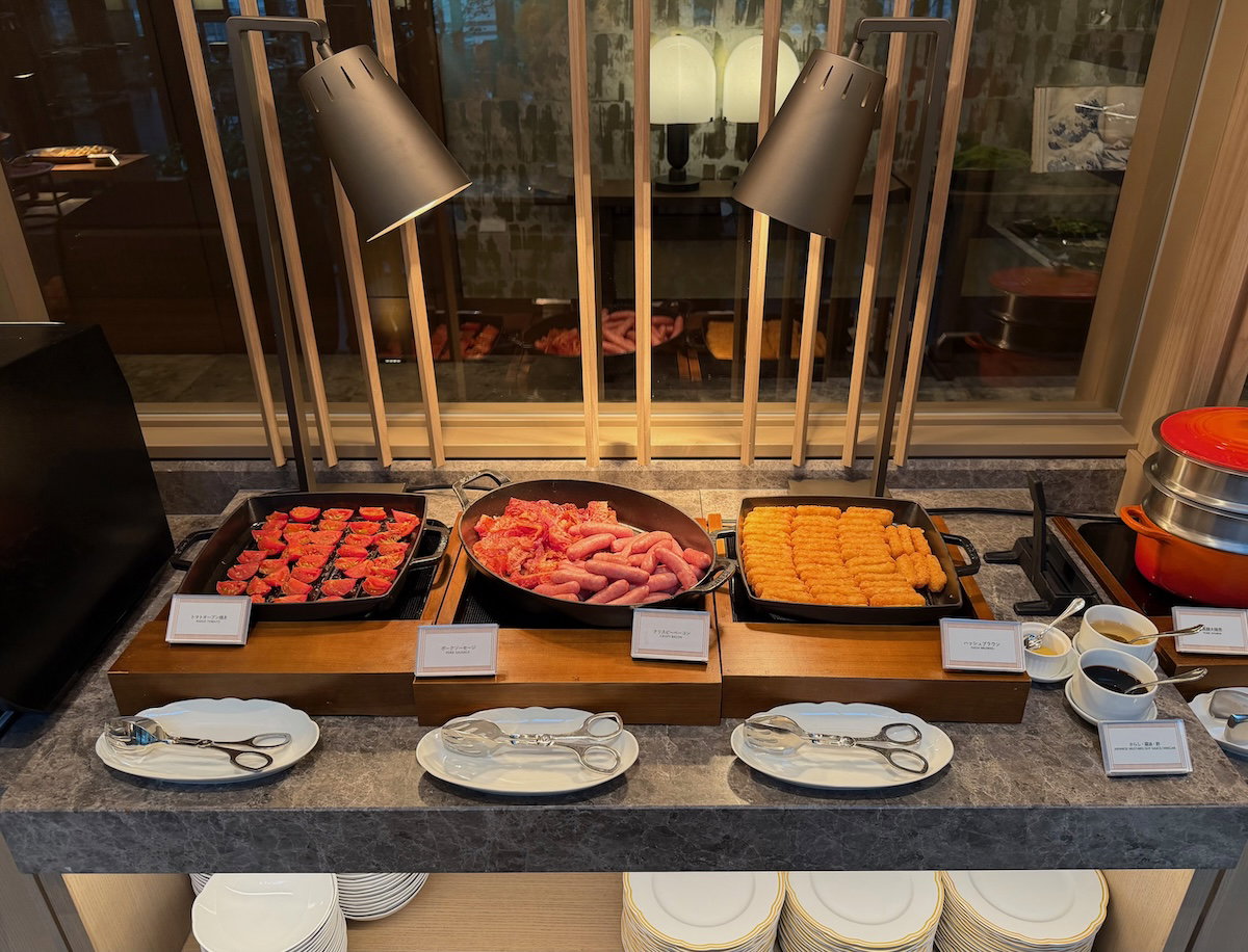 Breakfast buffet counter with assorted dishes at Jolie Brasserie