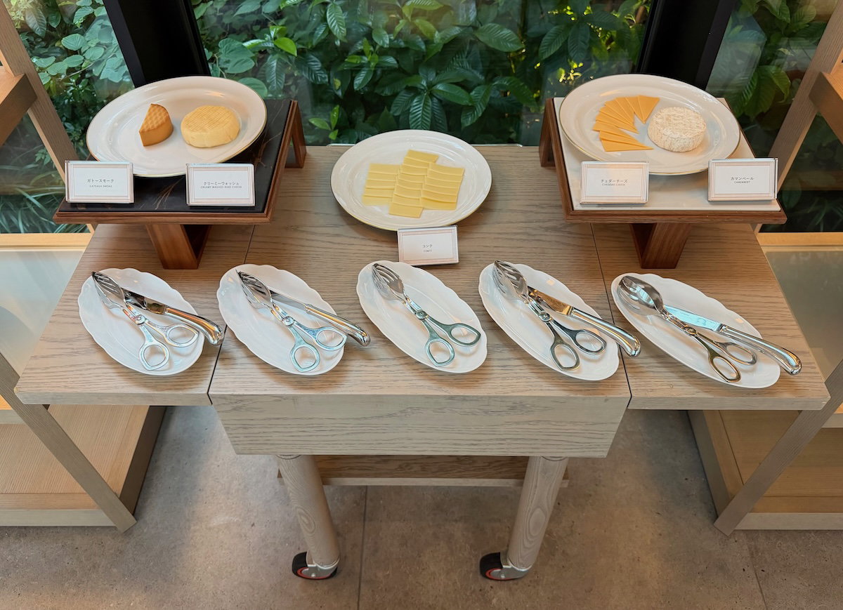 Compact buffet area at Jolie Brasserie where guests gather to select breakfast dishes